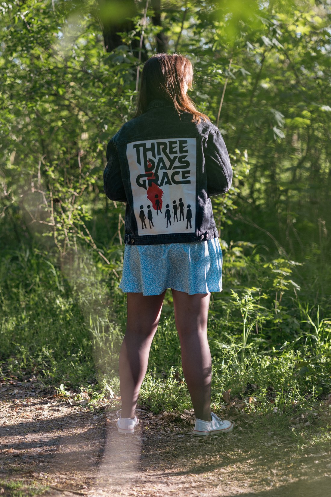 Hand-painted denim jacket, Three Days Grace design, worn outdoors