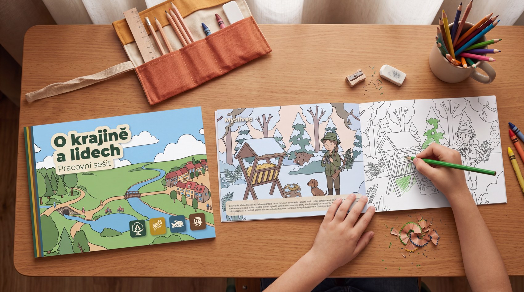 O krajině a lidech workbook and coloring book, styled on a desk with a child coloring